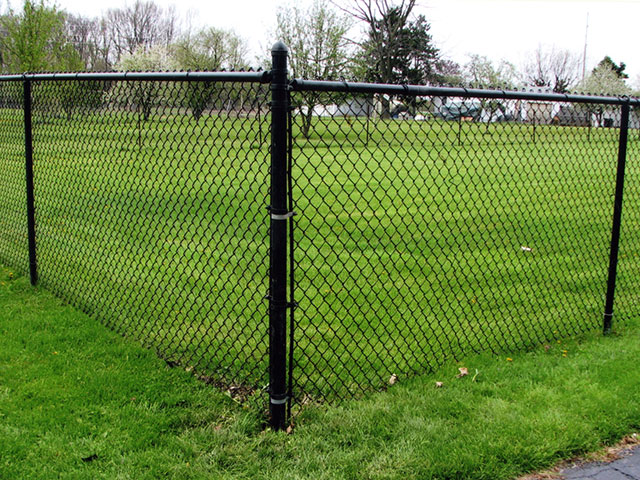 Residential chainlink and wood fence by Pickens Fence