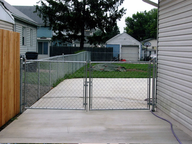 Residential chainlink and wood fence by Pickens Fence