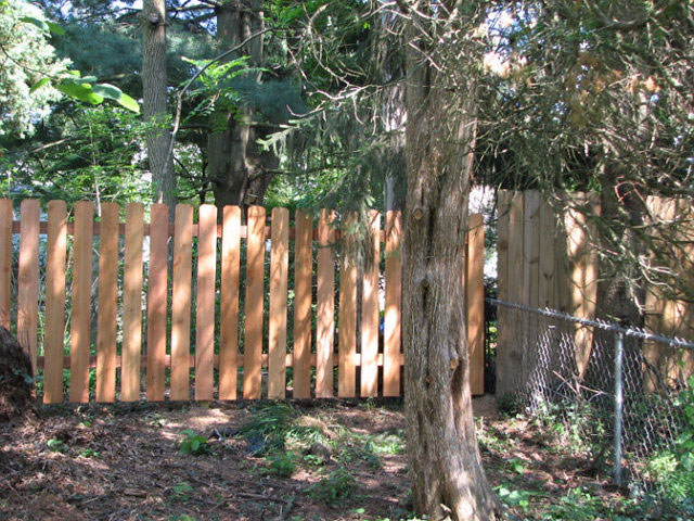Residential chainlink and wood fence by Pickens Fence